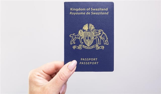  Hand Holding A Swaziland Passport