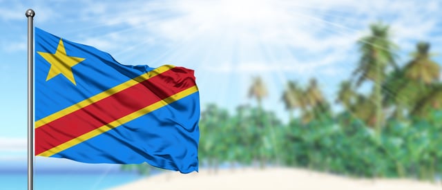 A DRC flag next to a beach