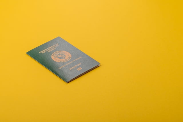 A Nigerian passport lying on a yellow background