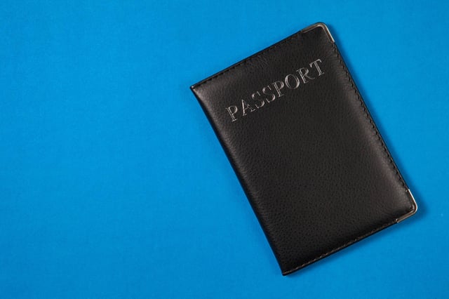 A passport on a blue background