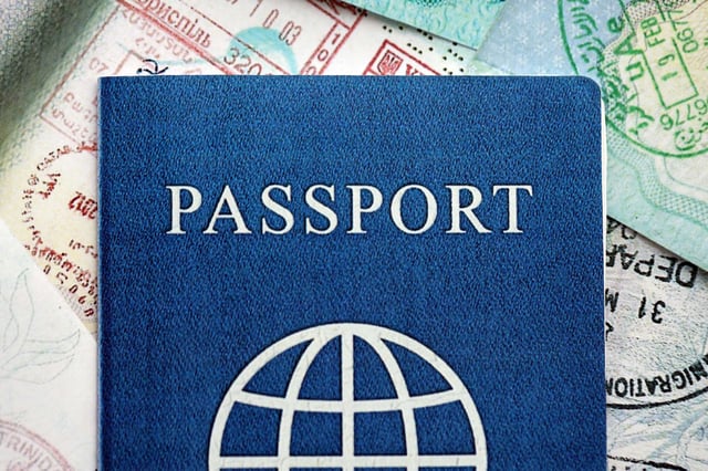 A Passport on top of some stamped documents