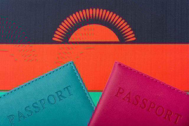 Flag of Malawi and two passports