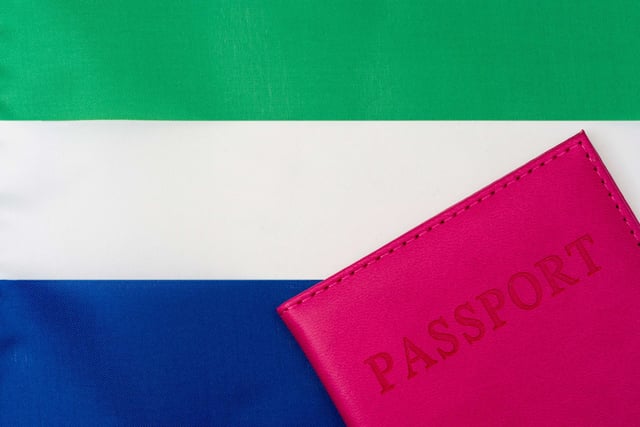 Flag of Sierra Leone next to a passport