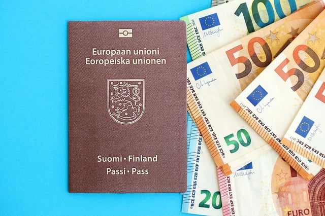 Passport of Finland with Euros next to it
