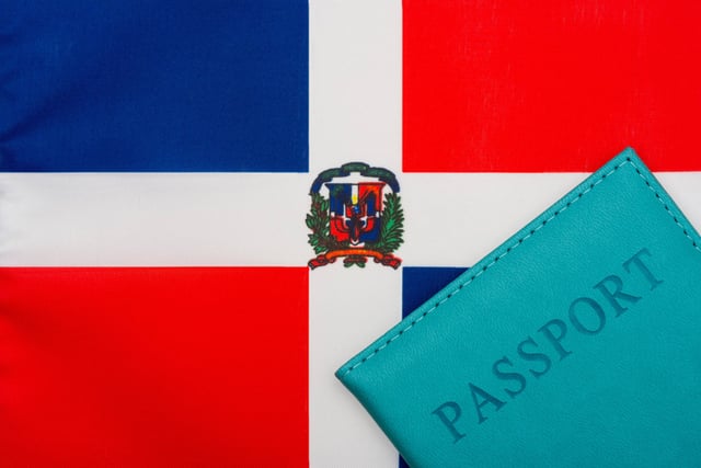 Passport on top of the Dominican Republic flag