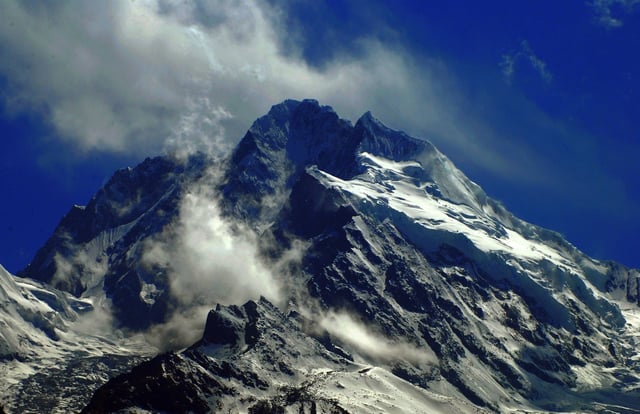 Snowy Mountain-Top on a Clear Sky