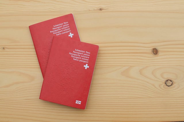 Swiss Passports On A Wooden Table