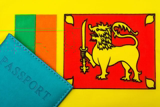 The flag of Sri Lanka next to a passport