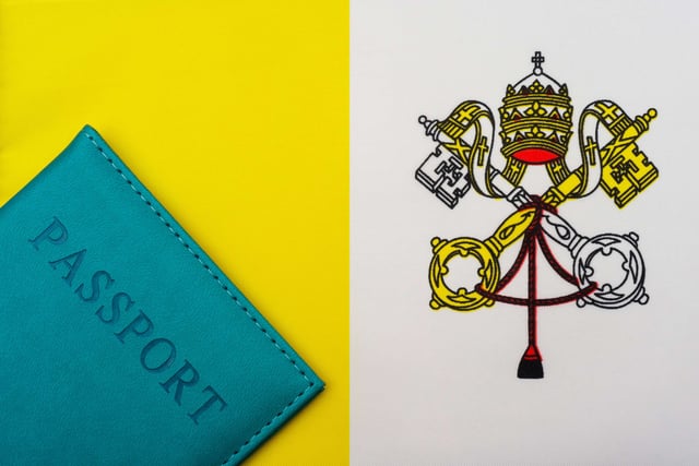 The flag of Vatican City alongside a passport