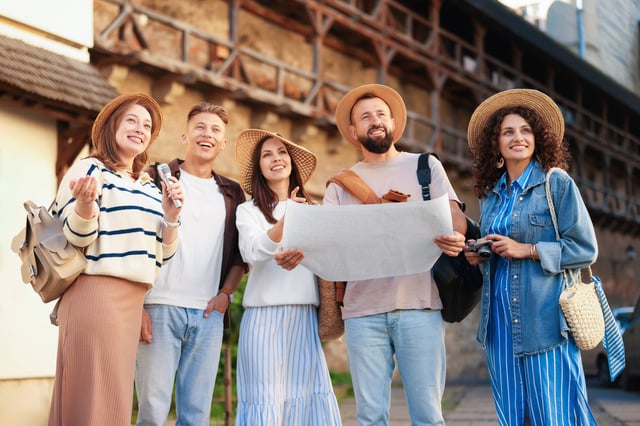 Tourists with a map looking around a city