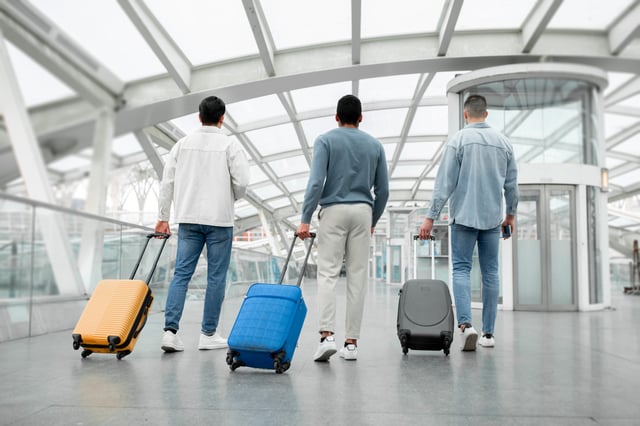 Travellers With Luggage At The Airport