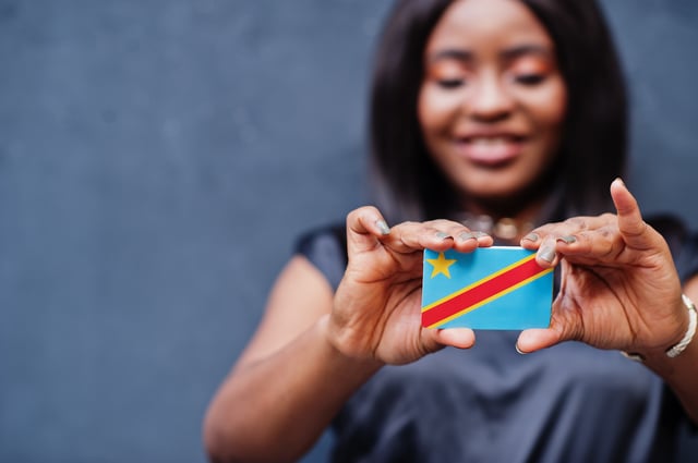 Woman holding the flag of the DRC