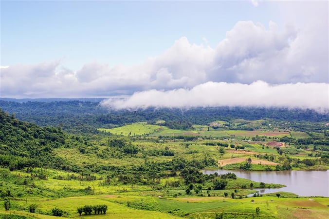 Panoramic View Of A Hillside And A Valley Under Clouds
