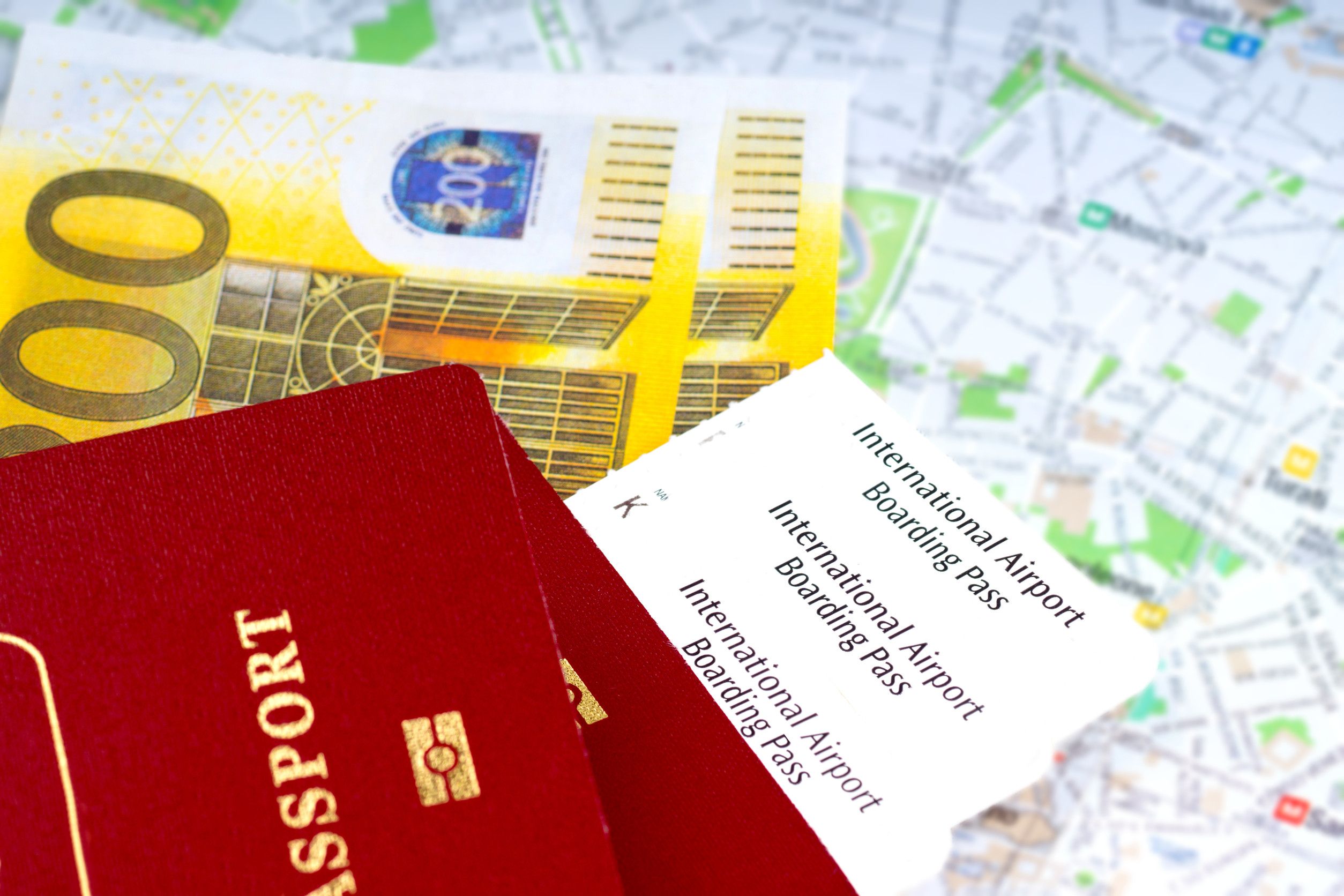 Passport Boarding Pass And Money Over Map Travel Concept
